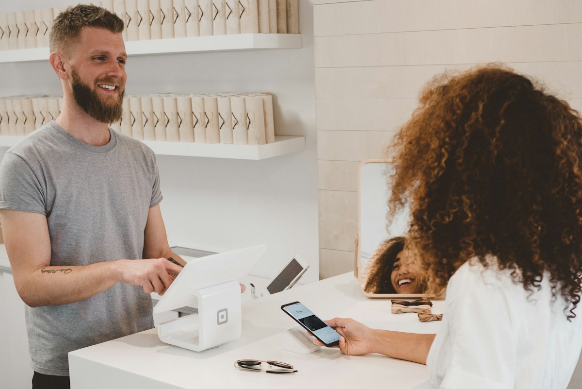 Customer making an in-house car payment at the counter